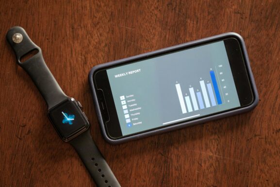 A smartphone and smartwatch on the table